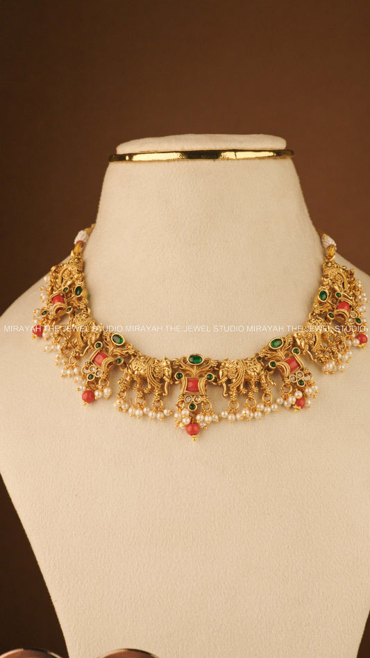 CORAL TUSKER NECKLACE