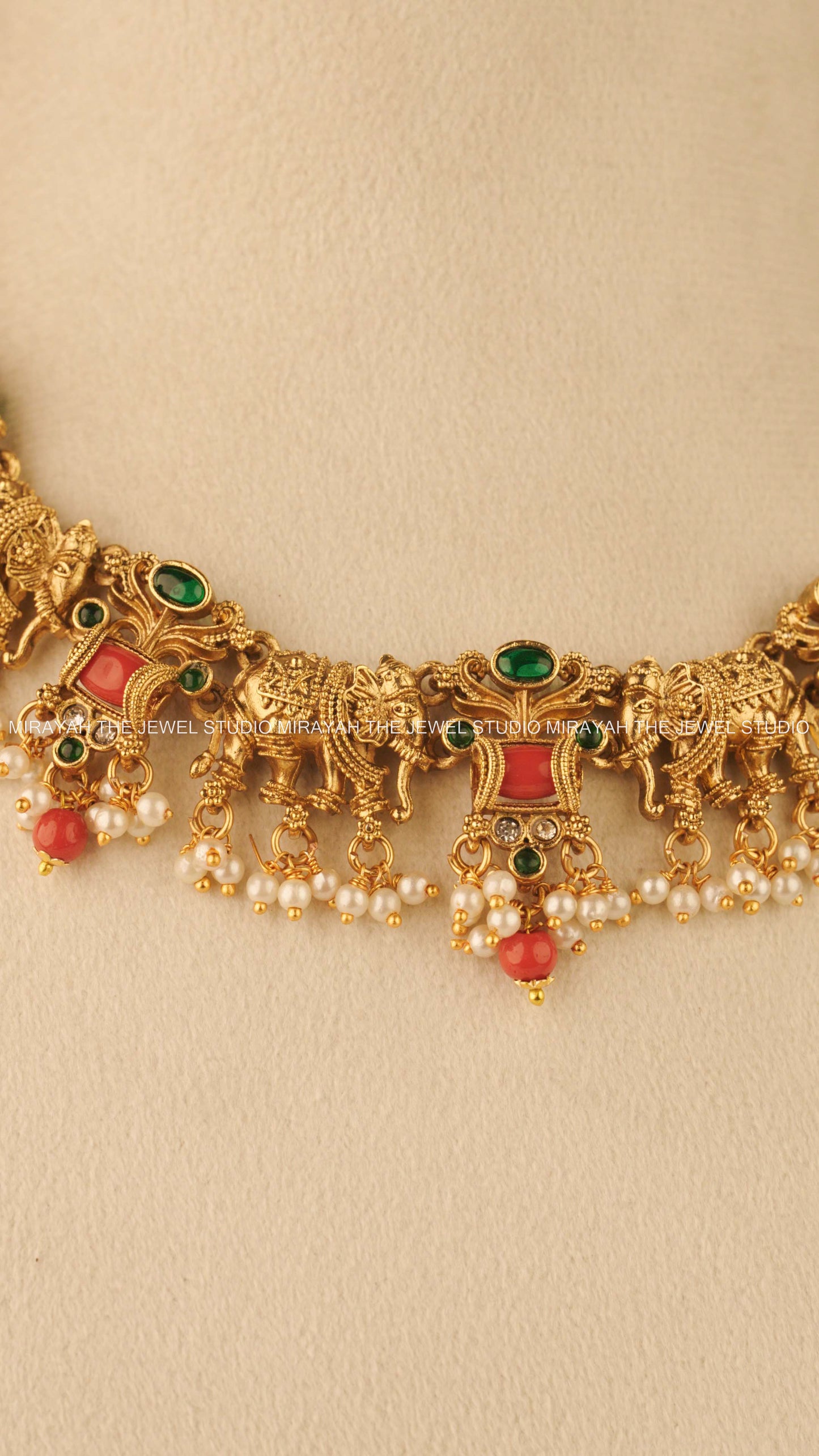 CORAL TUSKER NECKLACE