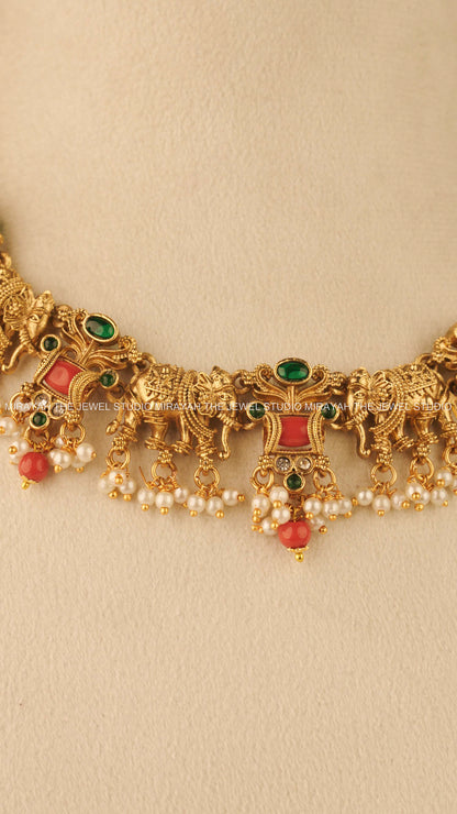 CORAL TUSKER NECKLACE